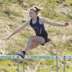 Not bad for a rookie: Sequim High freshman Jolene Vaara races to a win in the 100 hurdles in her first attempt in the event, finishing in 17.63 seconds. Sequim Gazette photo by Michael Dashiell