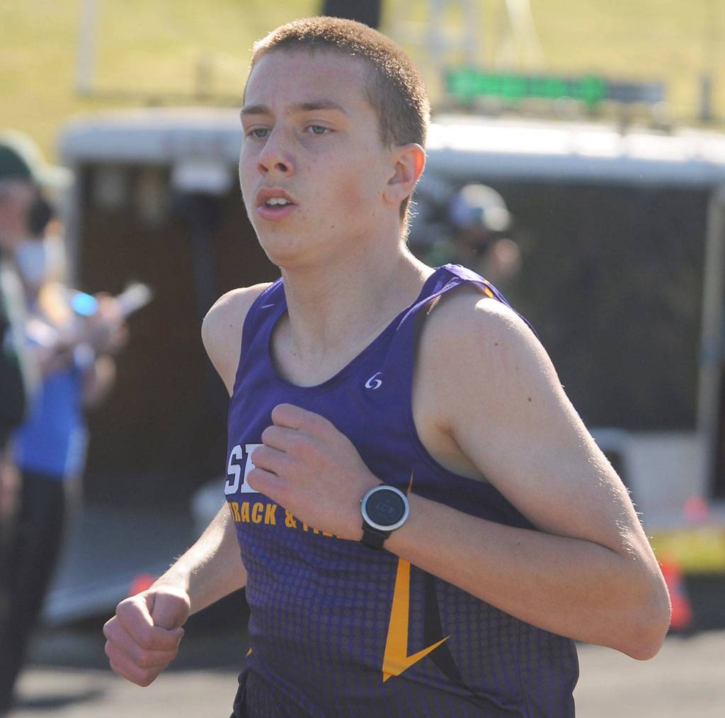 Sequim freshman Colby Ellefson races to a fourth place finish in the 1,600 meters at a league meet in Port Angeles on April 14, finishing in a personal best 4:52. Sequim Gazette photo by Michael Dashiell