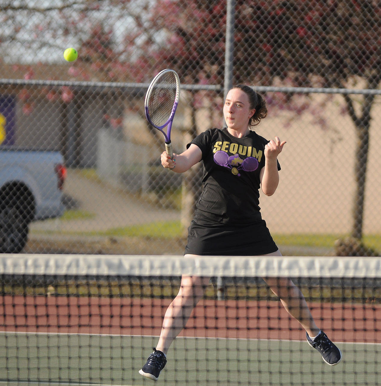 Sequims Malory Morey hits a forehand as she and doubles partner Sydney Sandstrom top North Kitsaps Tiffany Le and Sophia Loverich on April 19. Sequim won the overall match, 7-0. Sequim Gazette photo by Michael Dashiell