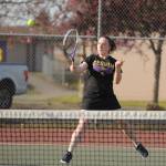 Sequims Malory Morey hits a forehand as she and doubles partner Sydney Sandstrom top North Kitsaps Tiffany Le and Sophia Loverich on April 19. Sequim won the overall match, 7-0. Sequim Gazette photo by Michael Dashiell