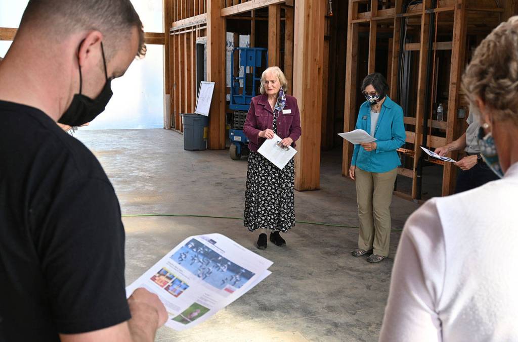 Annette Hanson, chair of the Inspire Wonder Capital Campaign helping fund the major renovation at the Dungeness River Audubon Center, explains to Sequim Sunrise Rotary Foundation board members about bird-safe windows to be installed. The club last week donated $250,000 to the project, with funds going to pay for the unique feature. Sequim Gazette photo by Michael Dashiell