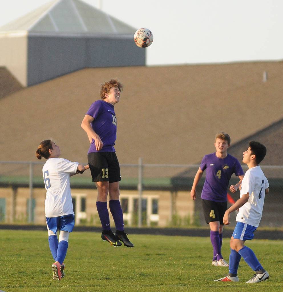 Sequims Brandon Charters (13) gets his head on a ball in the second half of the Wolves 6-1 win over Olympic. Sequim Gazette photo by Michael Dashiell