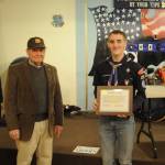 Jack Flanagan with VFW Post 4760 awards Jonathan Scott of Port Angeles the posts Scout of the Year award. Scott won the regional award too and moved on to the state and possibly the national competition.