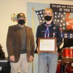 Jack Flanagan with VFW Post 4760 awards Jonathan Scott of Port Angeles the posts Scout of the Year award. Scott won the regional award too and moved on to the state and possibly the national competition.