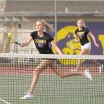 Sequims Kendall Hastings, foreground, puts away a point as sister McKenna backs her up in the Wolves 7-0 sweep of Bremerton on April 21. The Hastings duo topped Bremertons Jocelyn and Patricia Reyes, 6-1 and 6-0. Sequim Gazette photos by Michael Dashiell