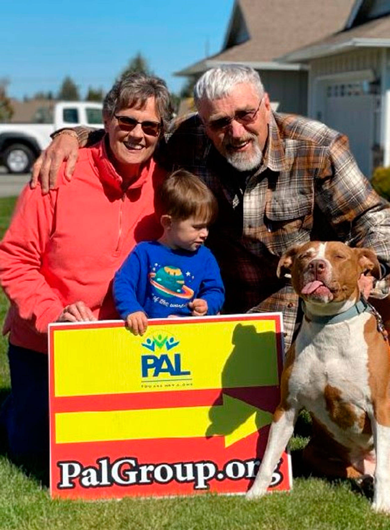 Corky and Cliff Schadler, pictured here with their 2-year-old grandson, were recently 
recognized for their efforts with the 
local Parents of Addicted Loved-ones (PAL) 
organization. Submitted photo