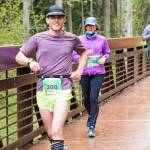 From left, Steve Moore of Kingston, Suzy Dintzis of Sequim and Mike Thomas of Port Angeles cross the historic Railroad Bridge in Sequim at the Run the Peninsula Railroad Bridge 10k this past weekend. Photo by Port Angeles Marathon Association