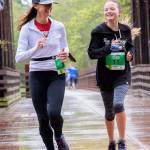 Above: Mother-daughter racers Katie and Audrey Rudd of Port Angeles cross the historic Railroad Bridge in Sequim at the Run the Peninsula Railroad Bridge 5k/10k this past weekend. Left:From 8 to 88: Roan Curran gets a visit from fellow Sequim runner Chuck Milliman at the end of the Railroad Bridge 10k run on April 24.