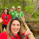 Virtual runners Prentice and Forester of Stafford, Va., complete their 10K Railroad Bridge walk with their daughter on a bridge over a creek on their property. Submitted photo