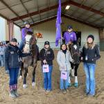 Sequim Equestrian Team seniors (back, left) Abby Garcia, on Burd, and Keri Tucker, on Nikki, take a break from the action at the second district meet in early April in Elma. Honoring the seniors are, from left, coach Katie Salmon-Newton and coaches Haylie Newton, Miranda Williams and Bettina Hoesel. Submitted photo