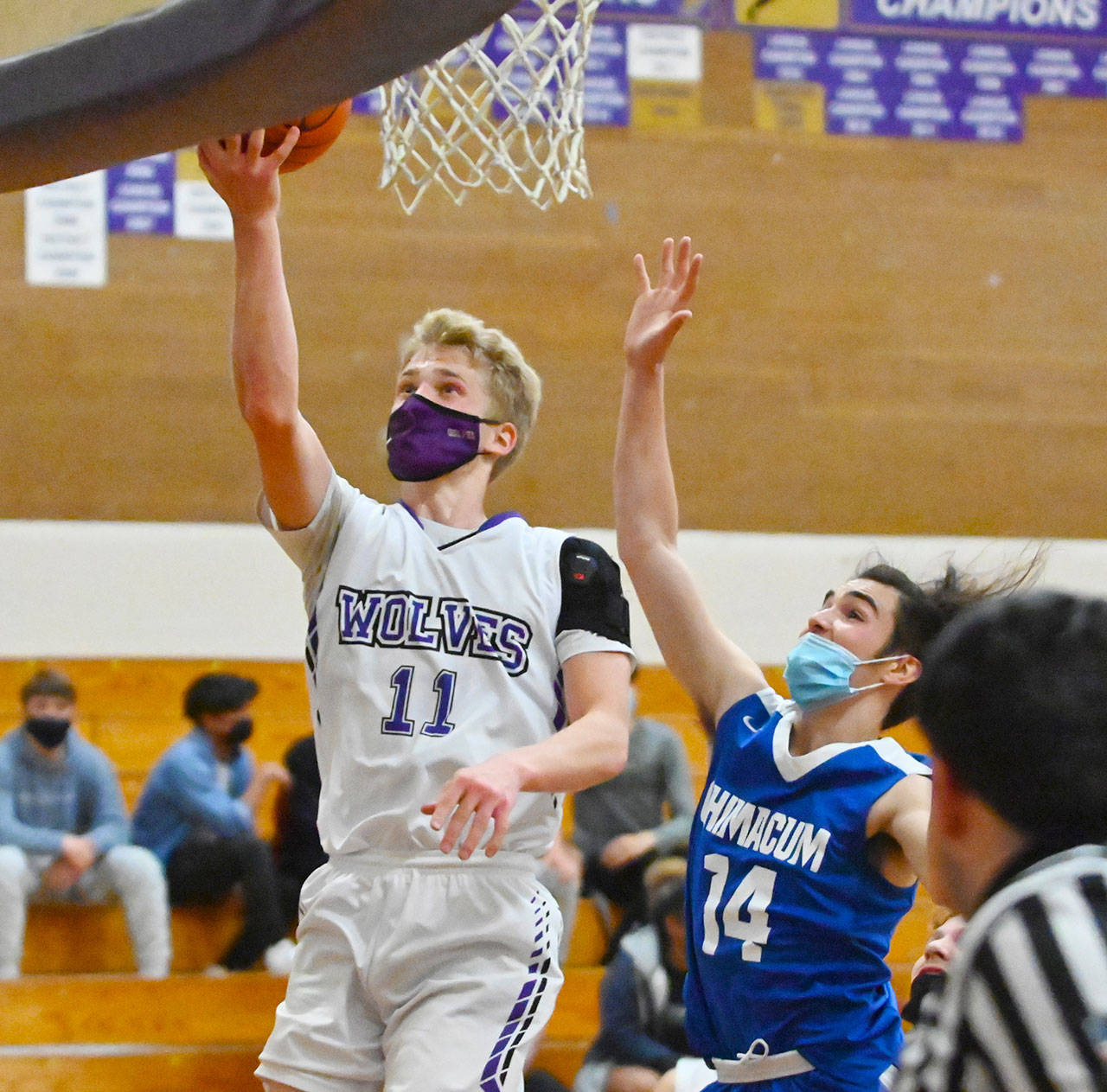 Sequim guard Erik Christiansen drives to the hoop for a basket in the Wolves 64-40 win over visiting East Jefferson on May 10. Christiansen, a senior, led the Wolves in scoring in 2019-2020. Sequim Gazette photo by Michael Dashiell