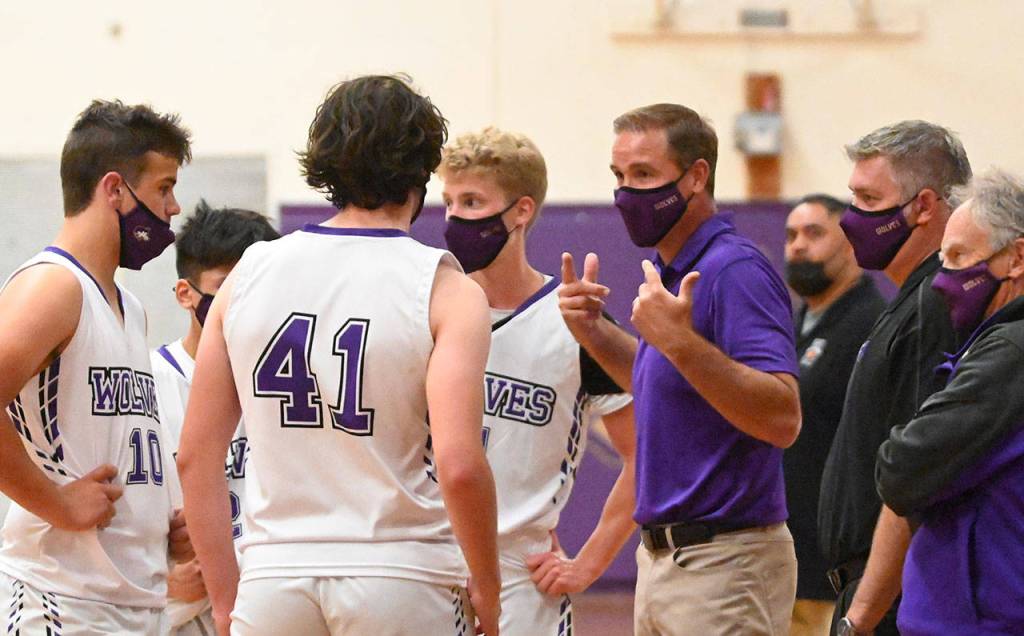 Sequim coach Greg Glasser talks to his players in the second half of the Wolves win over East Jefferson on May 10. Sequim Gazette photo by Michael Dashiell
