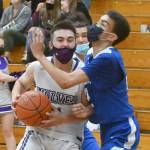 Sequim guard Jayden Possin drives to the basket for a score as the Wolves top East Jefferson on May 10. Sequim Gazette photo by Michael Dashiell