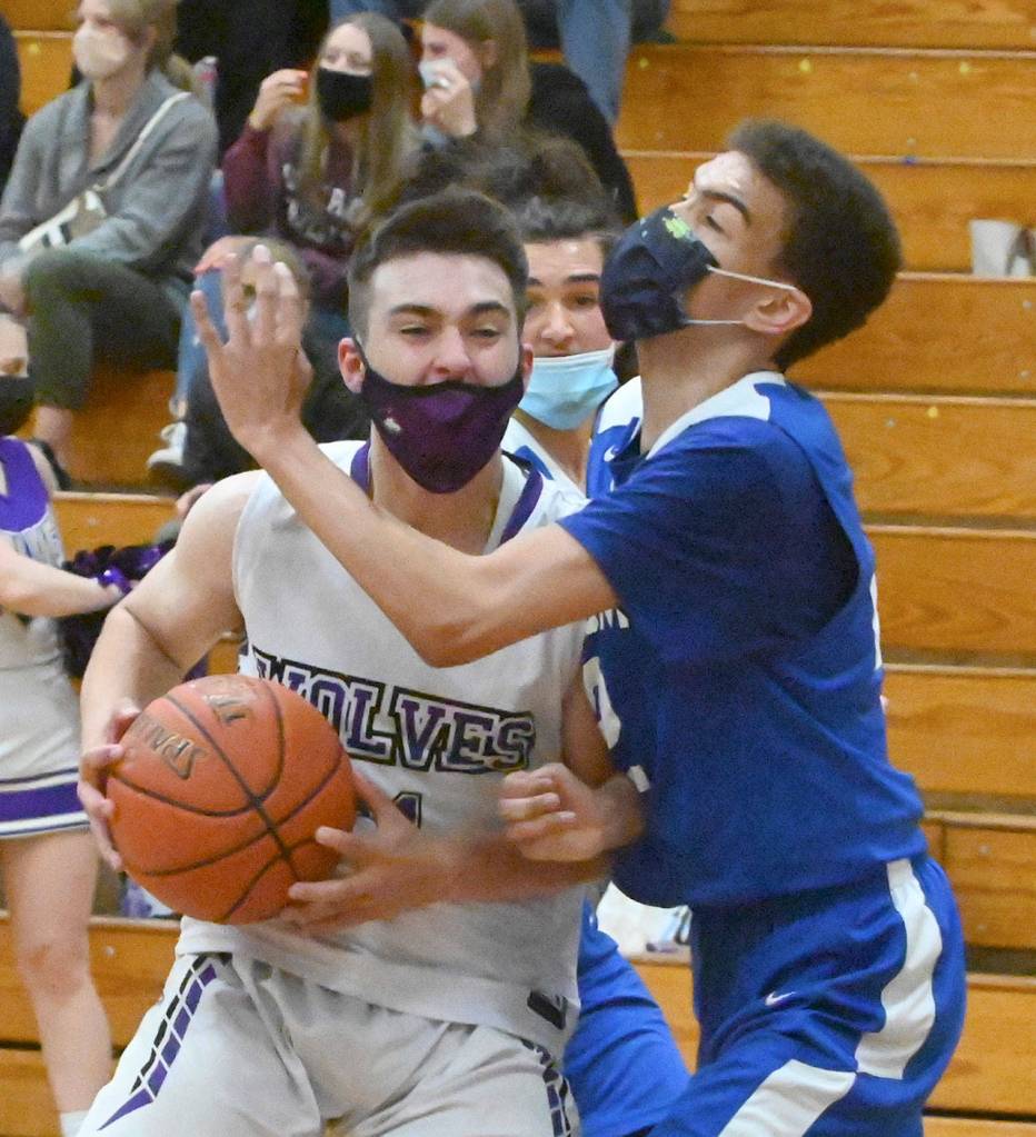 Sequim guard Jayden Possin drives to the basket for a score as the Wolves top East Jefferson on May 10. Sequim Gazette photo by Michael Dashiell
