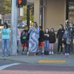 Residents gather for a quick photo-op for last years Sequim Irrigation Festival Grand Parade/Procession in downtown Sequim. Organizers plan to release the processions route on Friday, May 7. Sequim Gazette file photo by Matthew Nash