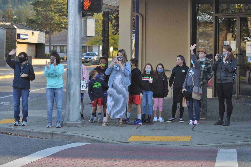 Residents gather for a quick photo-op for last years Sequim Irrigation Festival Grand Parade/Procession in downtown Sequim. Organizers plan to release the processions route on Friday, May 7. Sequim Gazette file photo by Matthew Nash