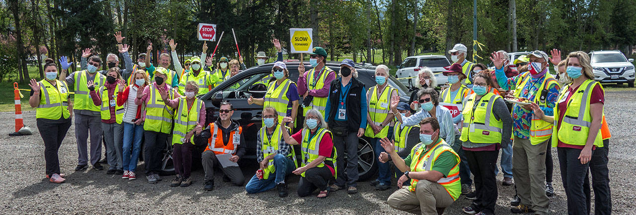 Jamestown Family Clinic workers and Community Emergency Response Team volunteers celebrate the final day of the mass vaccination drive-thru clinic on April 29 at Carrie Blake Community Park in Sequim. The last person to get a vaccination, volunteers report, was Diane Covollo. Photo by Charles Meyer