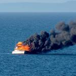 A 48-foot fishing yacht burns in the Strait of Juan de Fuca in this photograph captured by Port Angeles resident Ken Campbell.