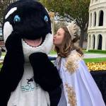 Sounder  the mascot of Grand Parade sponsor Sound Community Bank  gets a from Queen Hannah Hampton. Submitted photo