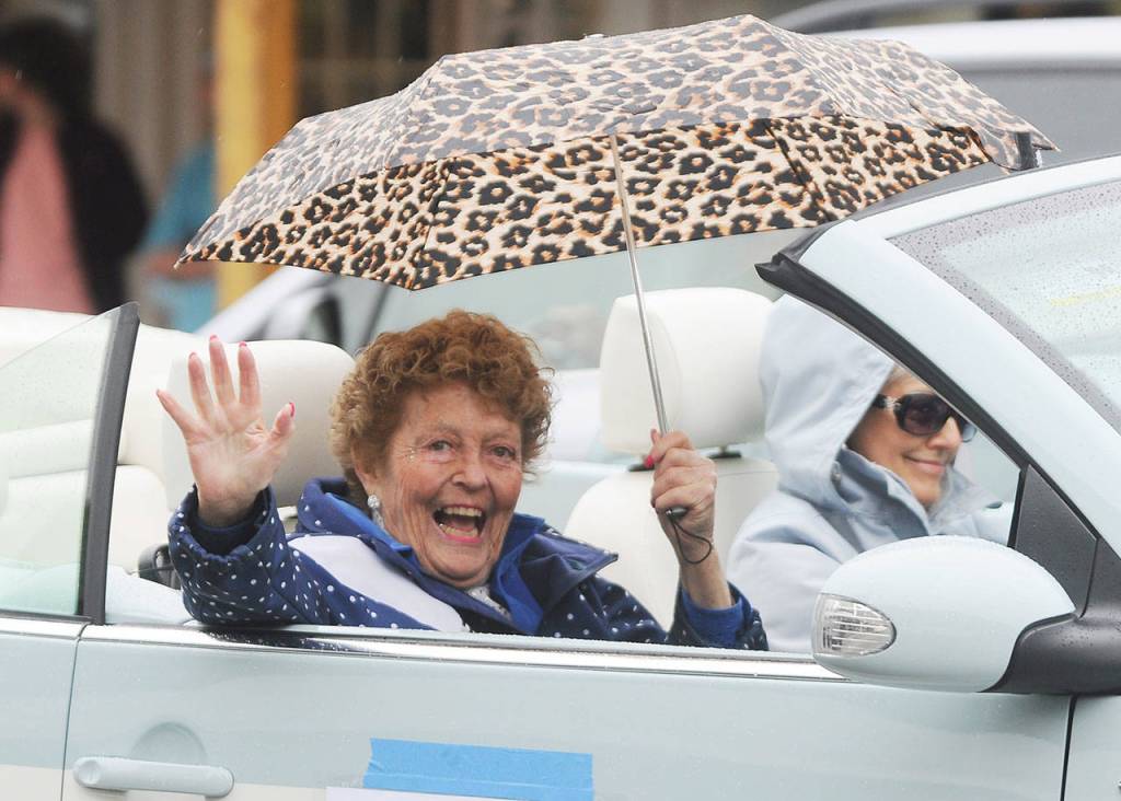 Honorary Pioneer Emily Westcott waves to onlookers on Washington Street during the May 8 Grand Parade. Sequim Gazette photo by Michael Dashiell