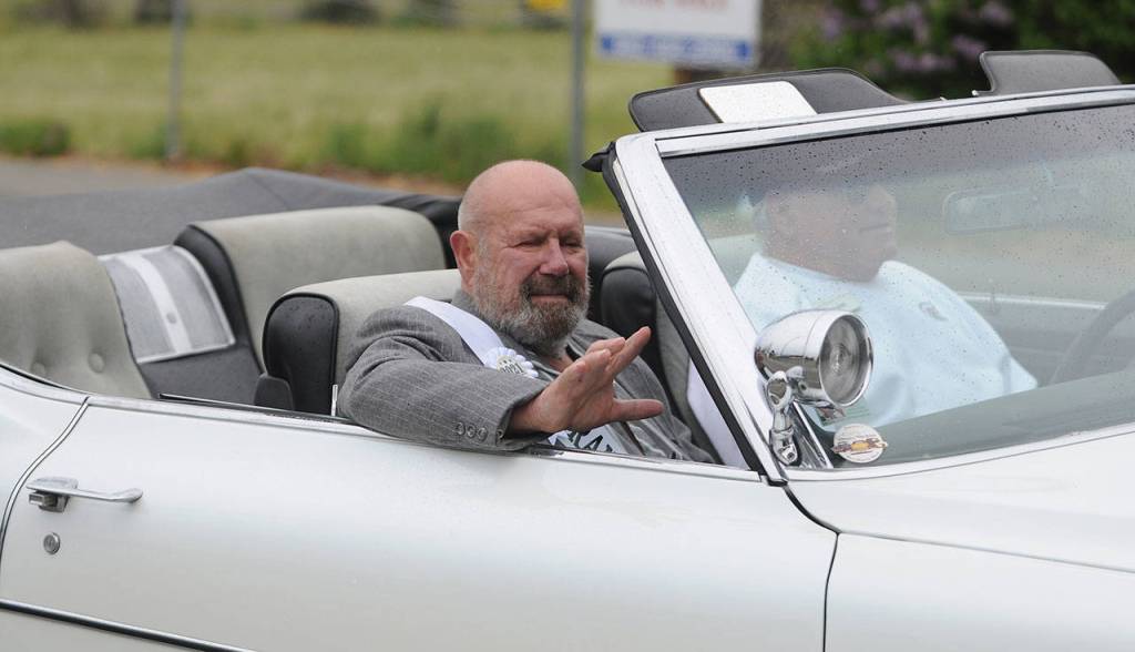 Grand Pioneer Dave Cameron says hi to onlookers on North Sequim Avenue during the May 8 Grand Parade. Sequim Gazette photo by Michael Dashiell