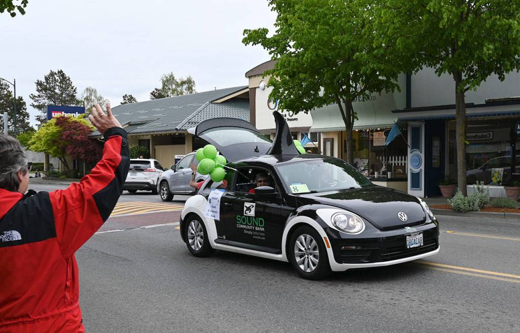The Sound Community Bank Orca car winds up the 2021 Irrigation Festival Grand Parade/Procession through downtown Sequim on May 8. Sequim Gazette photo by Michael Dashiell