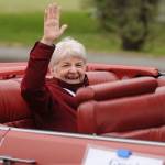Grand Marshal Amanda Beitzel waves to onlookers on North Sequim Avenue during the May 8 Grand Parade. Sequim Gazette photo by Michael Dashiell