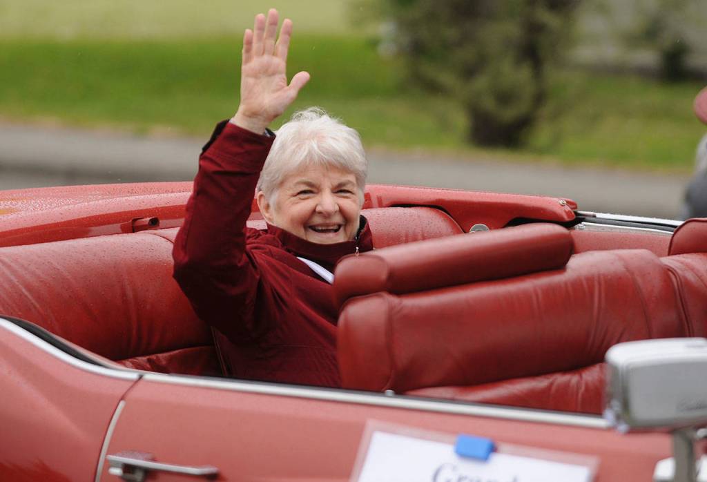 Grand Marshal Amanda Beitzel waves to onlookers on North Sequim Avenue during the May 8 Grand Parade. Sequim Gazette photo by Michael Dashiell