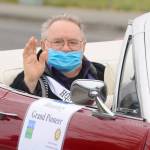 Honorary Pioneer Dick Parker waves to onlookers on North Sequim Avenue during the May 8 Grand Parade. Sequim Gazette photo by Michael Dashiell