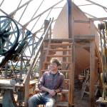 Leo Goolden, sits on stairs leading to the topside of the racing cutter Tally Ho in rural Sequim in early May. Photo by Keith Thorpe/Olympic Peninsula News Group