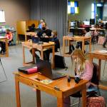 New desks made by Sequim Sunrise Rotarians help members of the Sequim Boys & Girls Club with remote learning and can fold up when not in use. Sequim Gazette photo by Matthew Nash