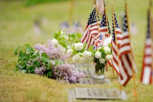 Flags at the Sequim View Cemetery adorn gravesites in 2020, just prior to Memorial Day. Local veterans groups canceled Memorial Day ceremonies last year with a statewide ban on large gatherings in place, but are looking to host in-person services later this month. Sequim Gazette file photo by Michael Dashiell