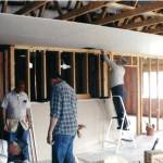 Volunteers work in 2002 on new office and bathroom space as part of an addition.