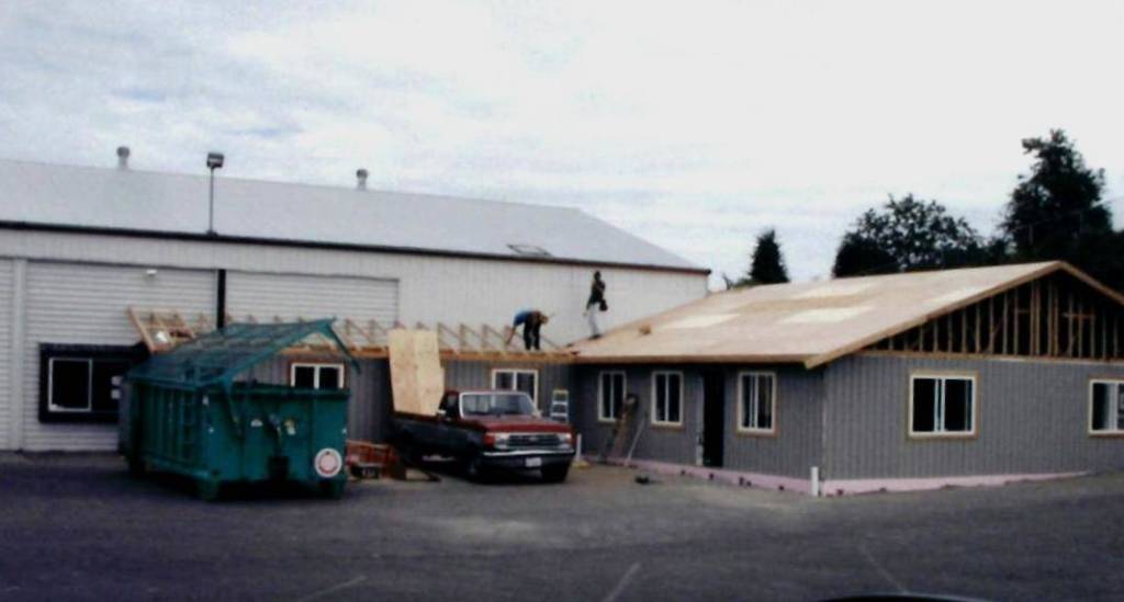 Volunteers work on the senior centers addition in 2002 a larger main room, a brighter art room, computer classroom, multi-purpose classroom, health services room, storage areas, new restrooms, café dining room, directors office and a new front-desk lobby.