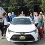 Past winners of the Great Olympic Peninsula Duck Derby grand prize gather at Swains General Store with Wilder Toyota owner Dan Wilder to gaze upon this years top prize, a 2021 Toyota Corolla, which is donated by Wilder. From left are Angeline Parrish, 2019 winner; Kim Skerbeck, 1995; Mary and Harry Hebert, 2002; Tom Baerman, winner along with wife Jackie in 2011; Dan Wilder; Steve Zenovic (2018); Annette Wendell, 1992; Dan Sinnes, 1998 and Zenovics wife Nina. All of the past 30 winners of the car have been from Port Angeles and Sequim, except for one.