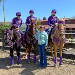 Sequims district gold medal-winning drill team celebrates a win. They include (back row, from left) Keri Tucker, Libby Swanberg and Susannah Sharp, with (in front) drill coach Haylie Newton.