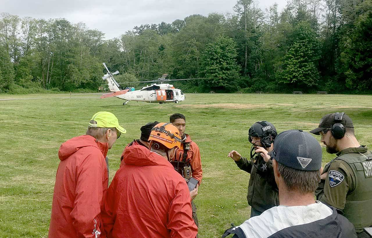 Search and Rescue team members used the Dosewallips State Parks field as their command post for the multi-agency rescue of two hikers who had fallen down the Brothers Mountain on May 23. Teams from Jefferson Search and Rescue, Jefferson County Sheriffs Office, Naval Air Station Whidbey Island Search and Rescue and Olympic Mountain Rescue responded to the emergency. Photo courtesy of Jefferson Search and Rescue