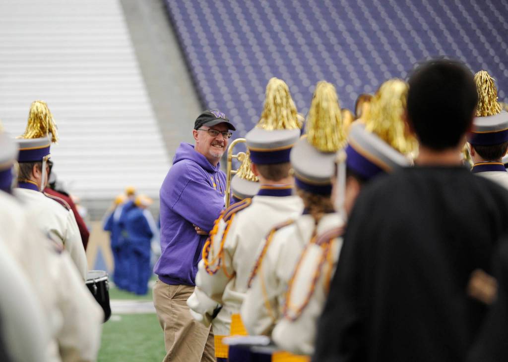 Vern Fosket, Sequim High School band director, keeps an eye on his students at the 2015 Husky Band Day in Seattle. Sequim Gazette file photo by Michael Dashiell