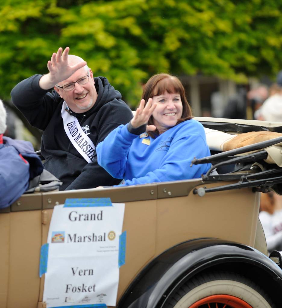 Vern Fosket, the 2017 Irrigation Festival grand marshal, enjoys the grand parade in style with wife Lynn. Sequim Gazette file photo by Michael Dashiell