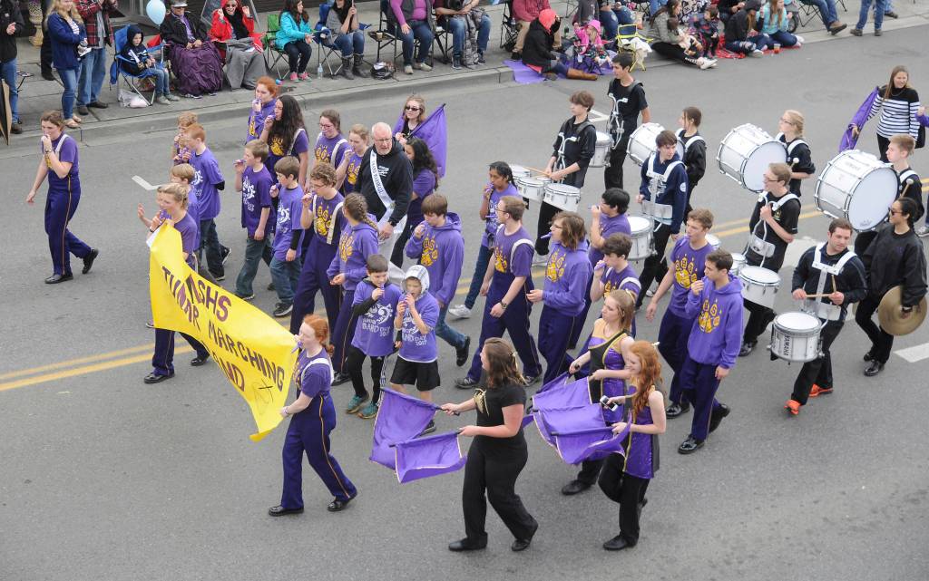 After doing the parade route as Grand Marshal, Vern Fosket joins his Sequim High marching band in the 2017 Sequim Irrigation Festival Parade. Sequim Gazette file photo by Michael Dashiell