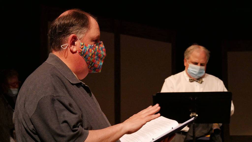 Steve Rodeman directs the cast of Dr. Watsons Workshop, with actor Joel Hoffman in the background. Photo courtesy of Olympic Theatre Arts