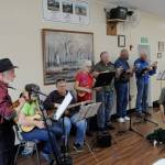 Mike Bare, on left, leads a group of ukulele players for Shipley Centers 50th anniversary in a number of tunes that encouraged audience members to sing-along. Sequim Gazette photos by Matthew Nash
