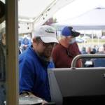Kurt Engel, chef and cafe manager for the recently rebranded Leos Café at Shipley Center, grills hot dogs for participants of the centers 50th anniversary on May 27. Sequim Gazette photo by Matthew Nash