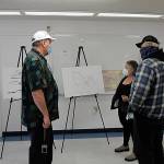 Shipley Center executive director Michael Smith, left, gives a tour of the center to Cassandra Cockrill and Jeff Ramanis. Sequim Gazette photo by Matthew Nash