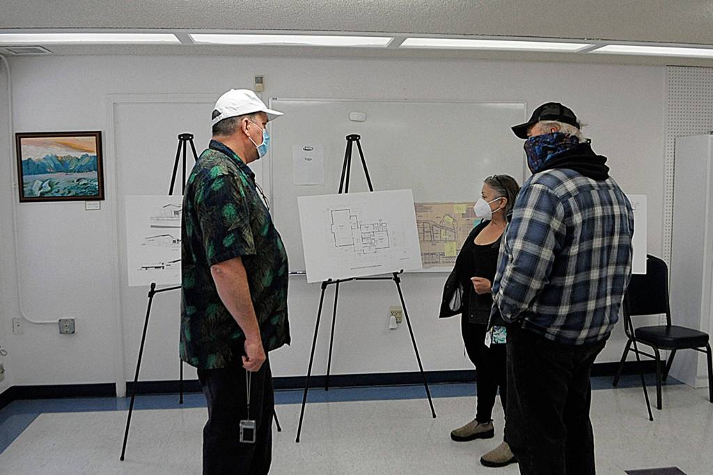 Shipley Center executive director Michael Smith, left, gives a tour of the center to Cassandra Cockrill and Jeff Ramanis. Sequim Gazette photo by Matthew Nash