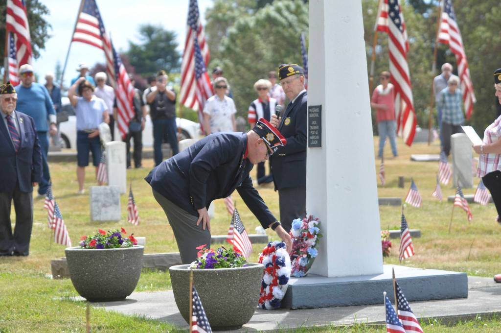 VFW Post 6787 Commander Rod Lee lays a wreath at the base of the Sequim View Cemetery monument at a Memorial Day ceremony on May 31. Sequim Gazette photo by Michael Dashiell