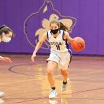 Sequim freshman guard Taryn Johnson looks for an open teammate in the Wolves 66-17 postseason-opening win over Bainbridge on June 5. Sequim Gazette photo by Michael Dashiell