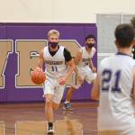 Sequim guard Erik Christiansen looks for a teammate as he brings the ball upcourt in the Wolves loss to class 3A Central Kitsap on June 2. Sequim Gazette photo by Michael Dashiell