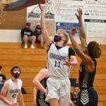 Sequim guard Erik Christiansen drives past Maurice Green to the basket for a score in the Wolves 72-49 loss to Central Kitsap on June 2. Sequim Gazette photo by Michael Dashiell