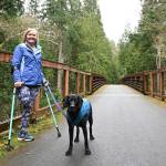Dana Lawson and Stella enjoy a trek on the Olympic Discovery Trail in mid-March. Lawson, a Port Angeles resident, is training to participate in the North Olympic Discovery Marathon between Sequim and Port Angeles , set for Sunday. Sequim Gazette file photo by Michael Dashiell